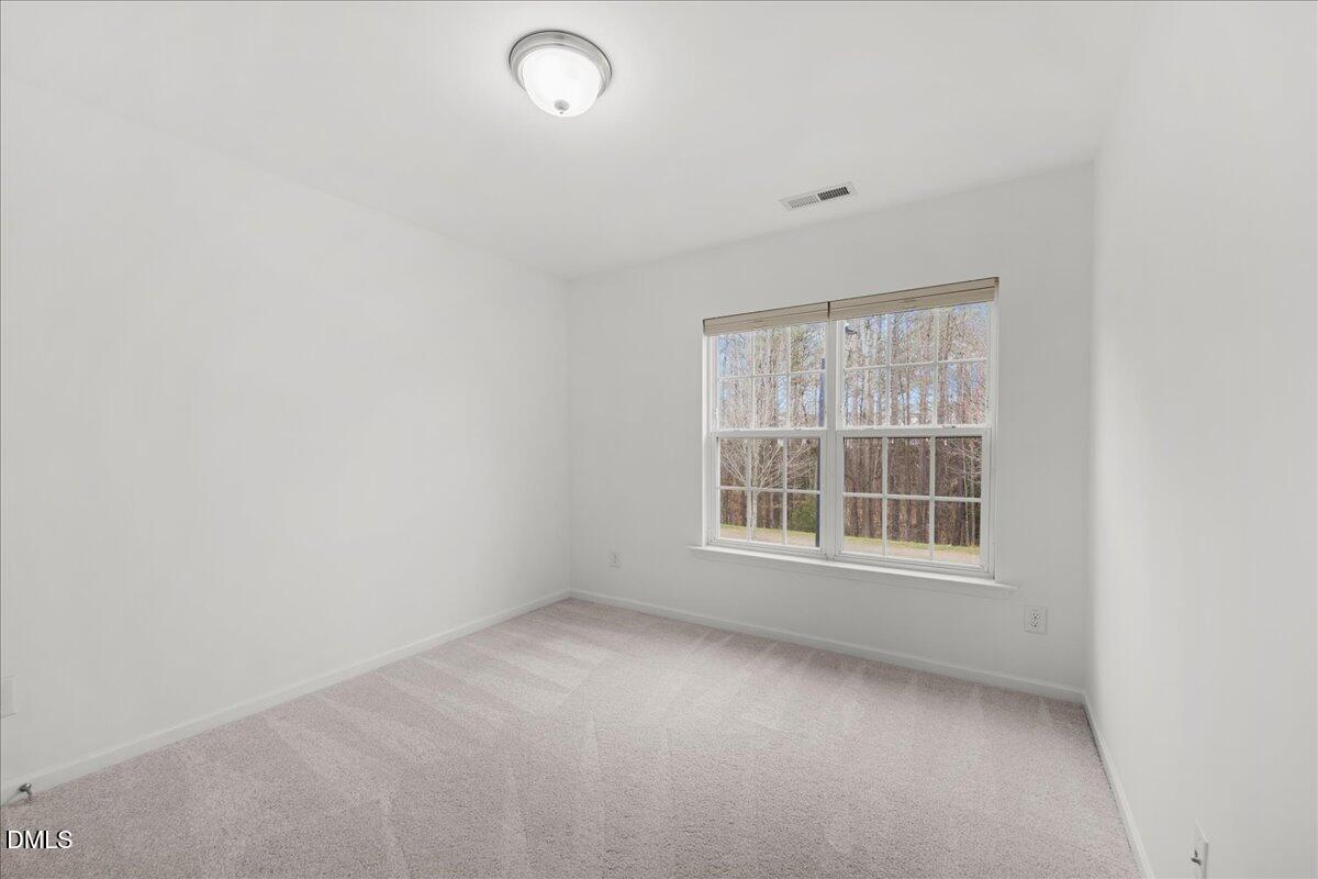 1003 Ileagnes Road Raleigh, NC 27603 - Photo 26 of 42 an empty room with a window