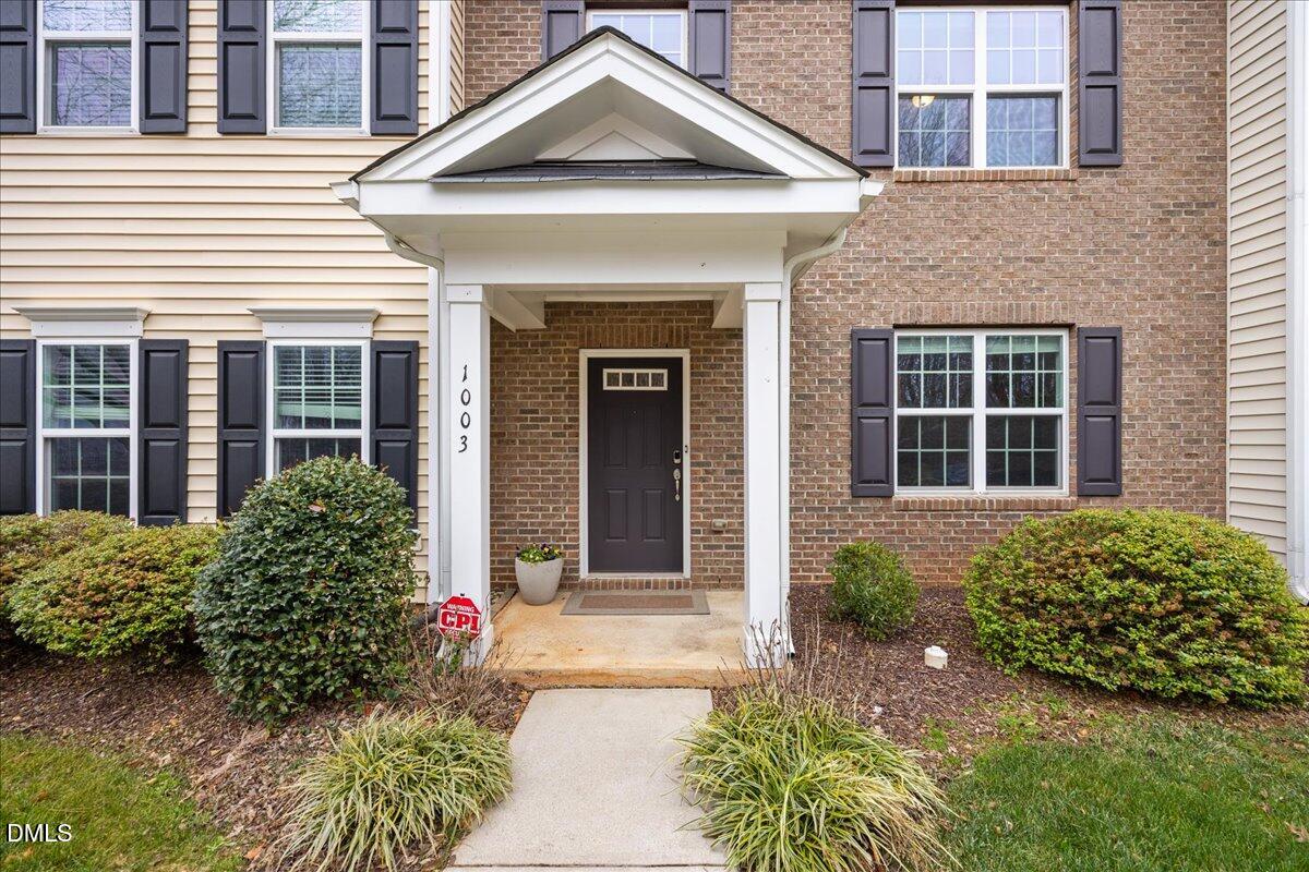 1003 Ileagnes Road Raleigh, NC 27603 - Photo 2 of 42 a front view of a house with garden