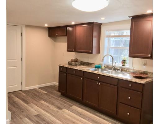 155 Methuen Street Springfield, MA 01119 - Photo 4 of 24 a bathroom with a granite countertop sink a mirror and a