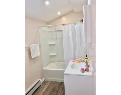 155 Methuen Street Springfield, MA 01119 - Photo 6 of 24 a bathroom with a sink a bath tub and a shower curtain