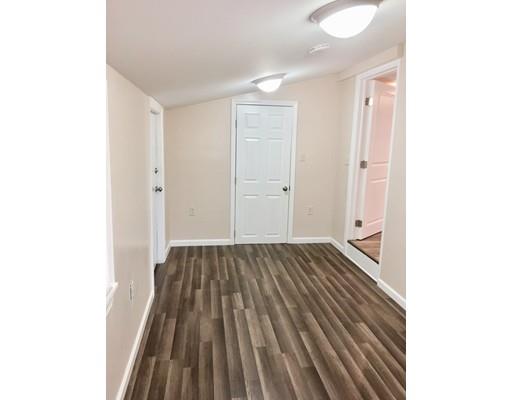 155 Methuen Street Springfield, MA 01119 - Photo 9 of 24 a view of a room with wooden floor
