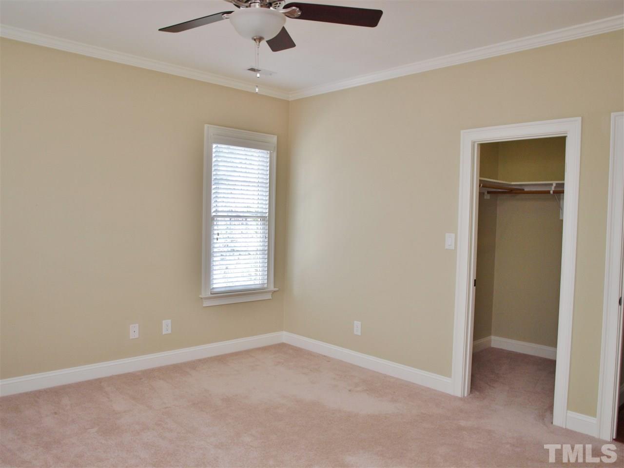 2100 Summer Azure Way Raleigh, NC 27613 - Photo 15 of 25 an empty room with a window and a fan