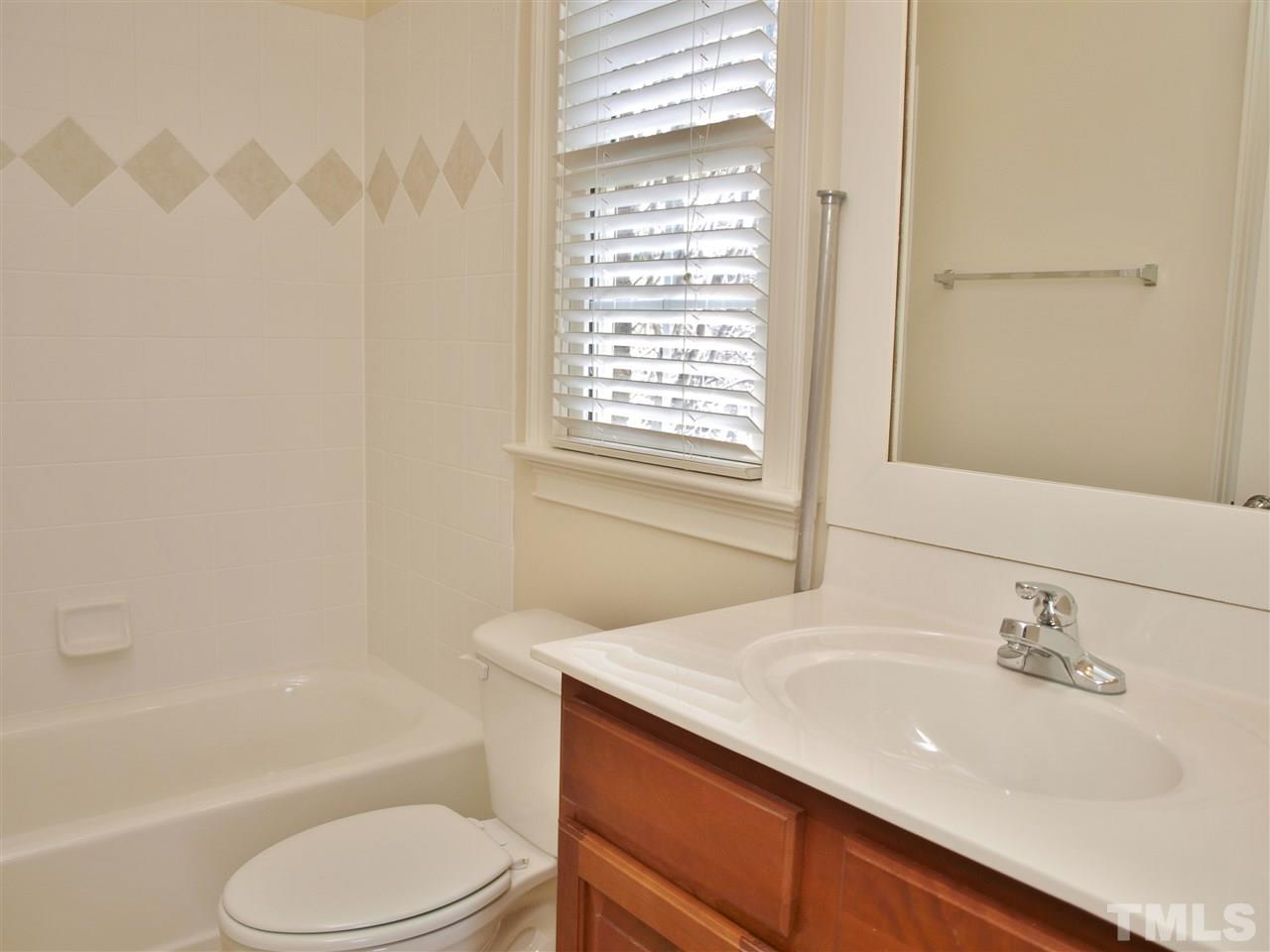 2100 Summer Azure Way Raleigh, NC 27613 - Photo 16 of 25 a bathroom with a sink toilet vanity and bathtub