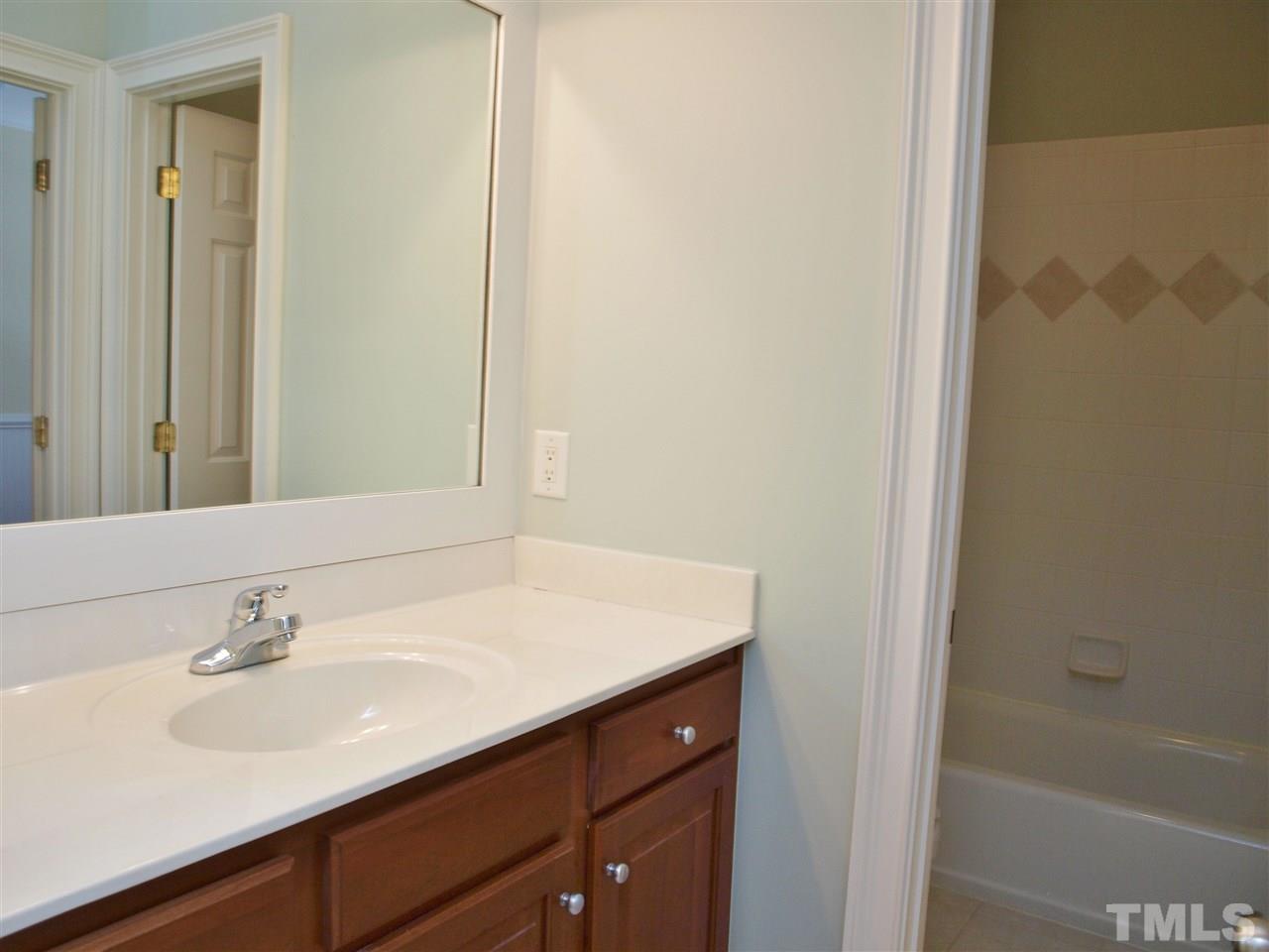 2100 Summer Azure Way Raleigh, NC 27613 - Photo 20 of 25 a bathroom with a sink and a bathtub