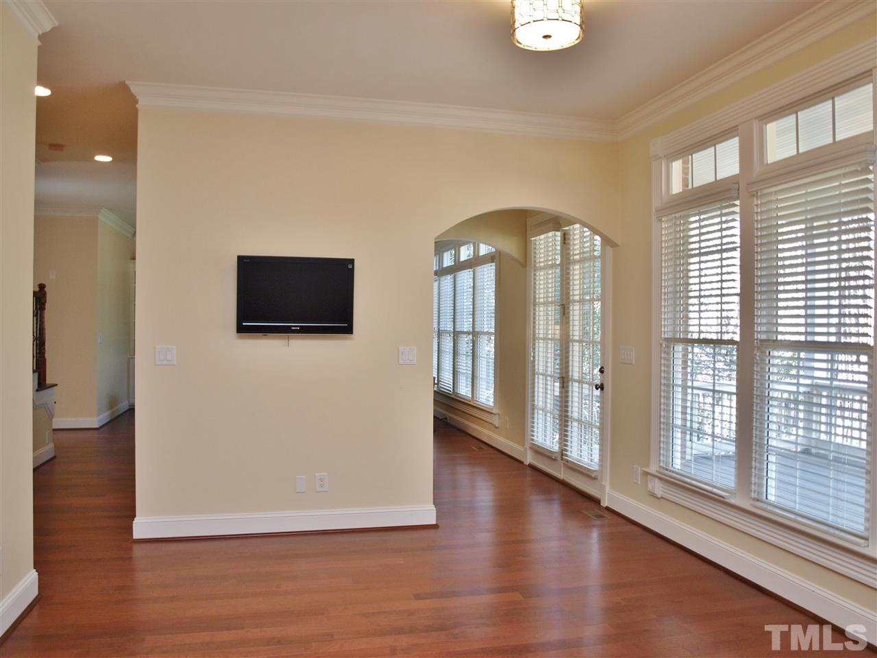 2100 Summer Azure Way Raleigh, NC 27613 - Photo 6 of 25 a view of a livingroom with wooden floor and windows
