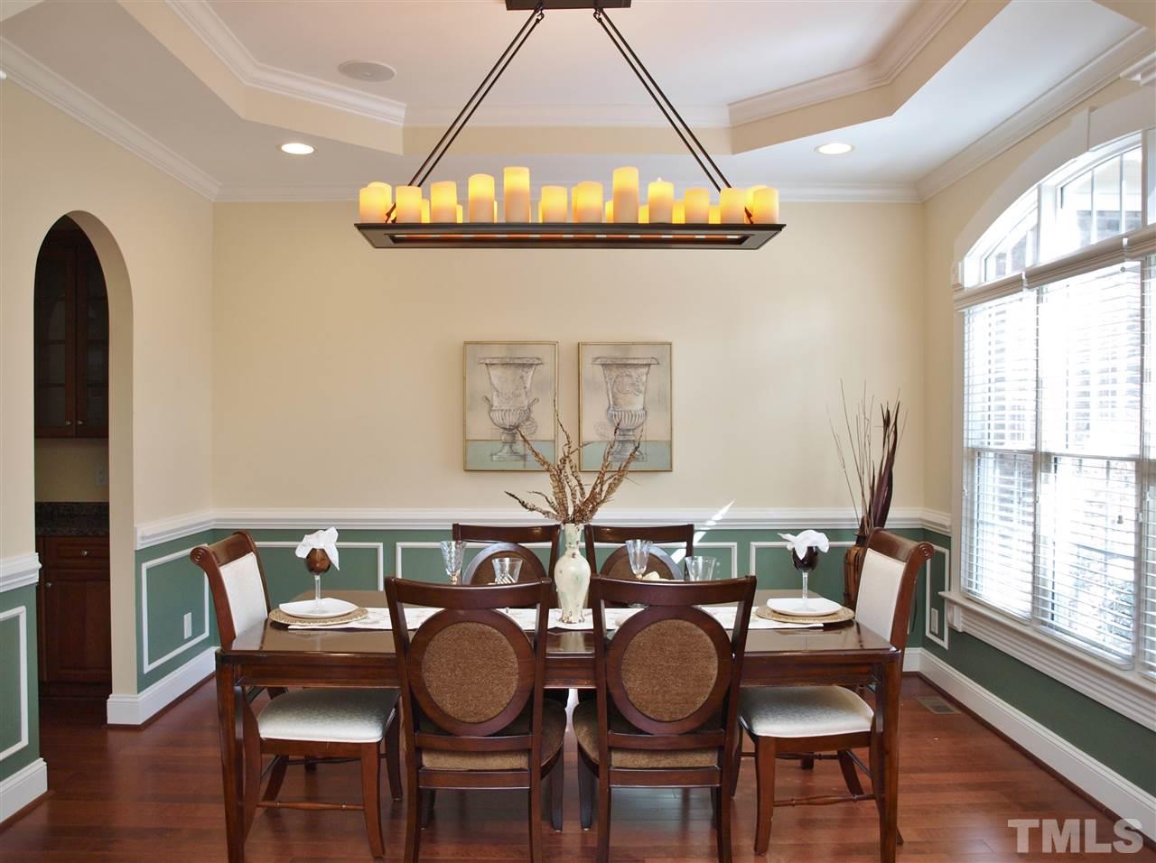 2100 Summer Azure Way Raleigh, NC 27613 - Photo 8 of 25 a dining room with furniture and wooden floor