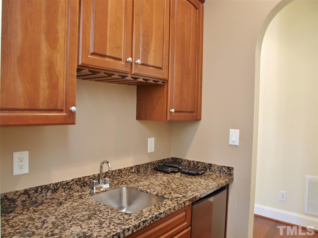 2100 Summer Azure Way Raleigh, NC 27613 - Photo 9 of 25 a kitchen with a sink a stove and cabinets