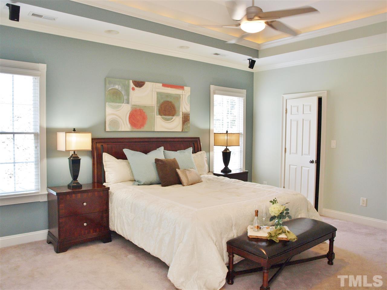 2100 Summer Azure Way Raleigh, NC 27613 - Photo 10 of 25 a bedroom with a bed and wooden floor