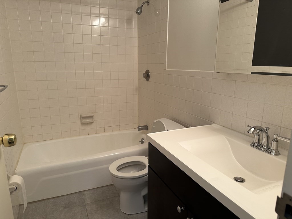 2 Summit Drive, Unit 21 Wakefield, MA 01880 - Photo 12 of 19 a bathroom with a sink a toilet and bathtub