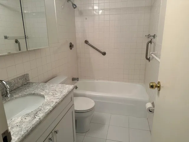 a view of a hallway with a wooden door