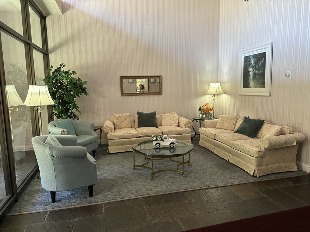 2 Summit Drive, Unit 21 Wakefield, MA 01880 - Photo 3 of 19 a living room with furniture and a potted plant