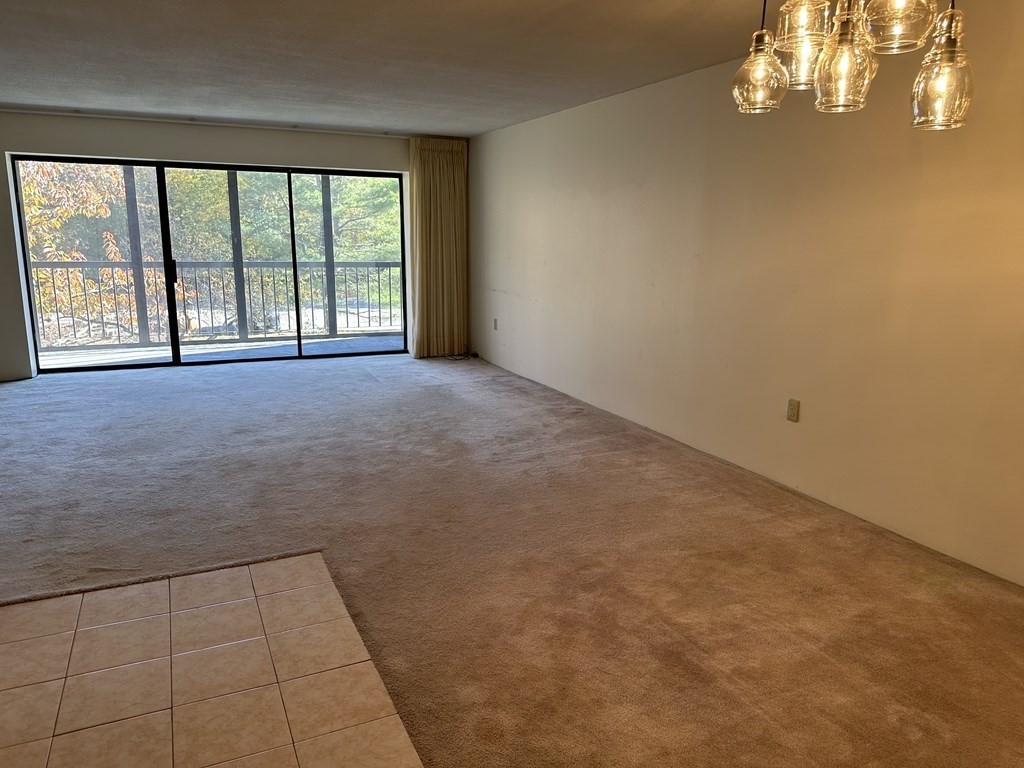 2 Summit Drive, Unit 21 Wakefield, MA 01880 - Photo 8 of 19 a view of an empty room with a window