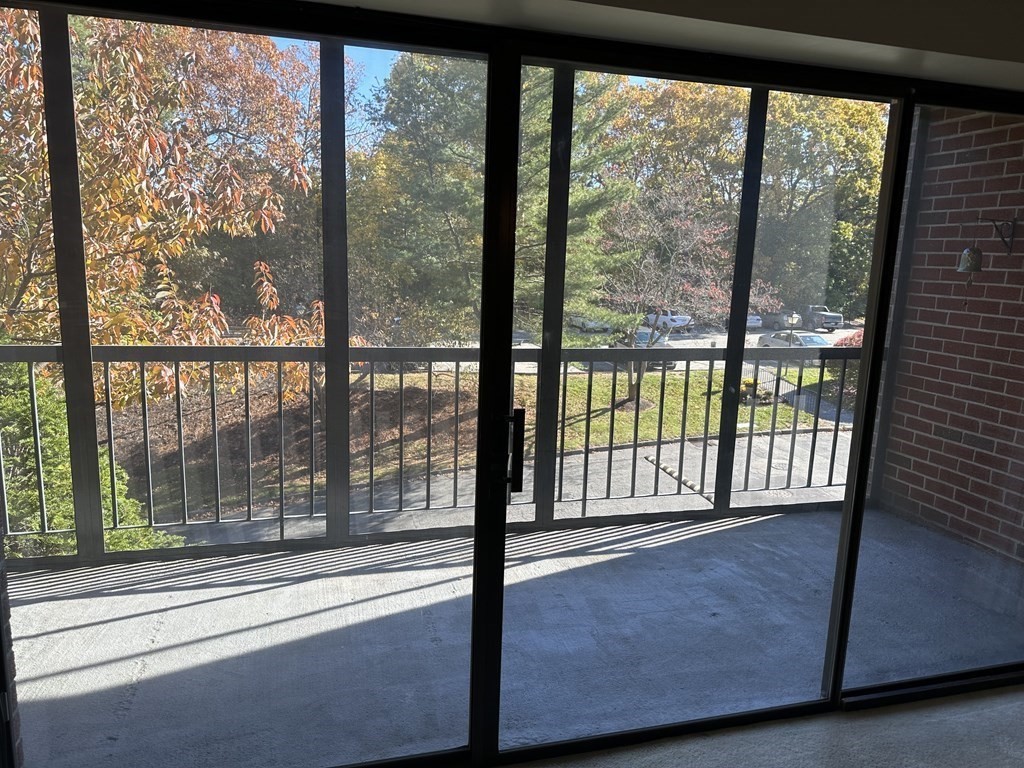2 Summit Drive, Unit 21 Wakefield, MA 01880 - Photo 10 of 19 a view of a large window with a balcony