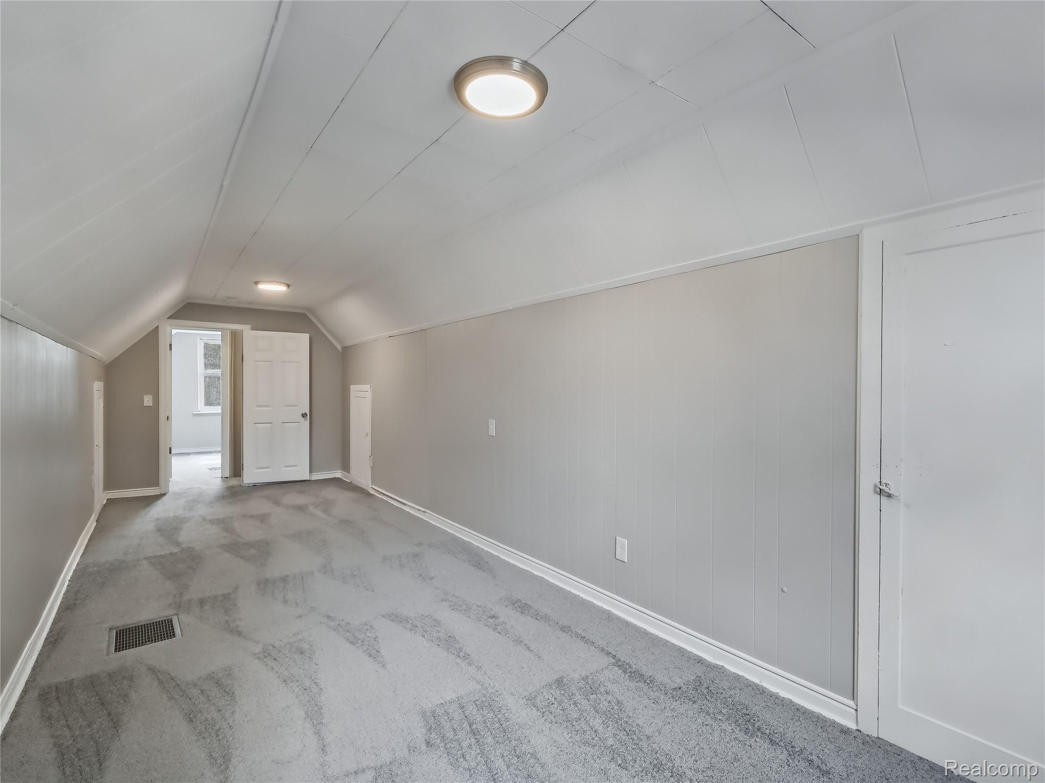 8220 Hudson Avenue Warren, MI 48089 - Photo 20 of 28 Bonus room featuring lofted ceiling and carpet floors