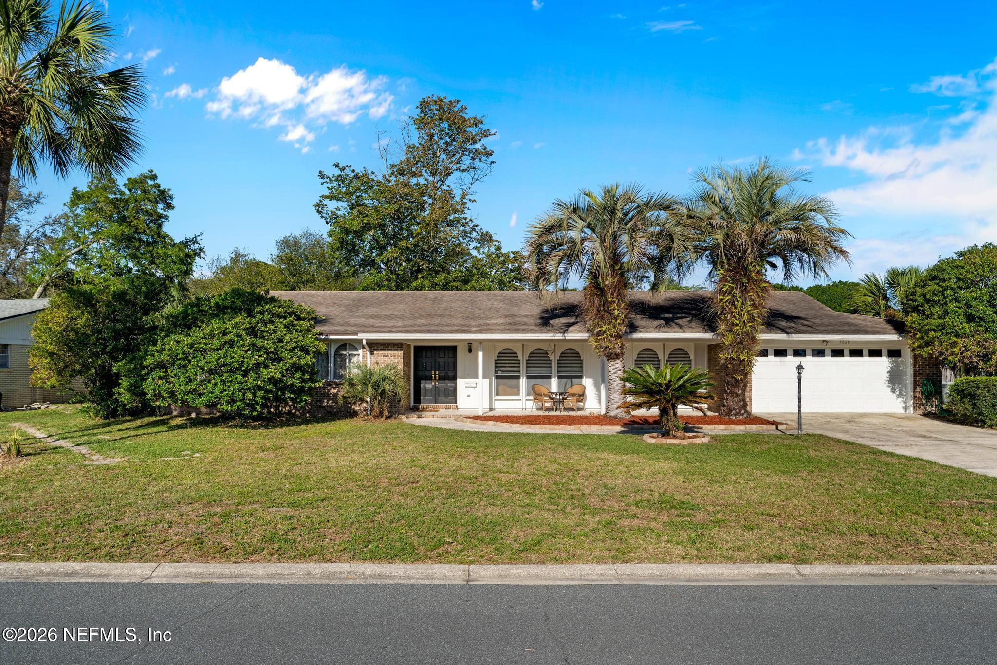 5628 Fort Sumter Road Jacksonville, FL 32210 - Photo 1 of 45 a front view of a house with a yard