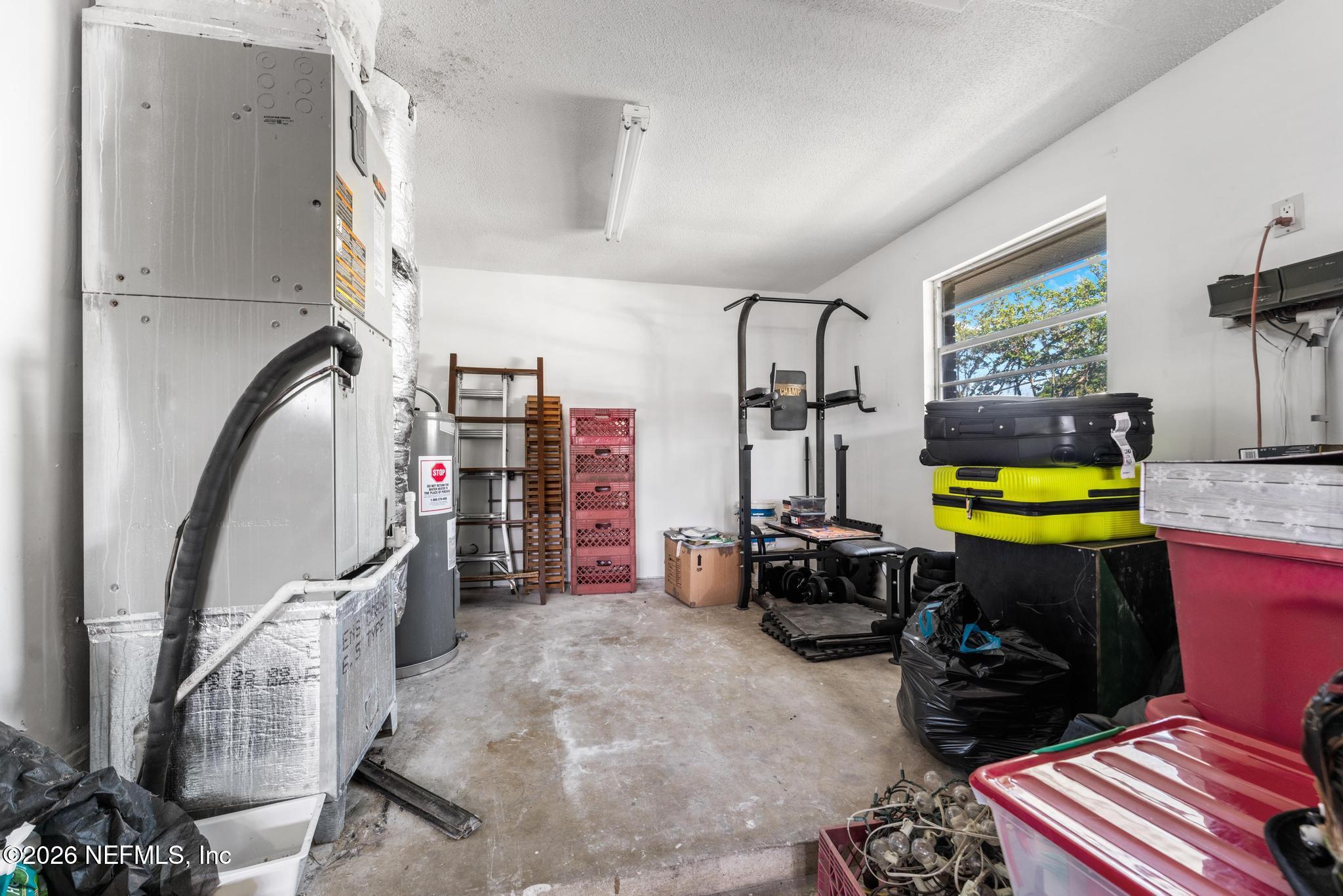 5628 Fort Sumter Road Jacksonville, FL 32210 - Photo 32 of 45 a room with furniture and gym equipment