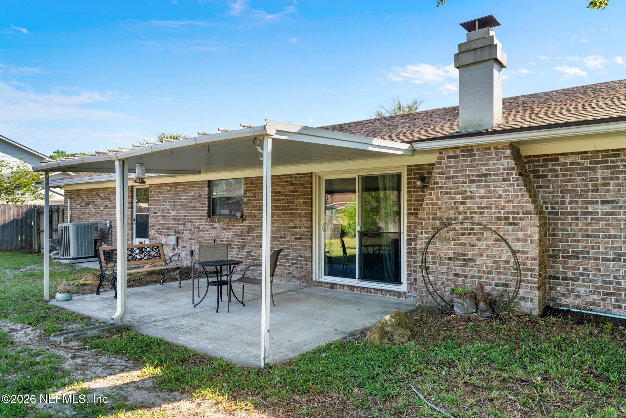 5628 Fort Sumter Road Jacksonville, FL 32210 - Photo 40 of 45 a front view of a house with a yard and seating space