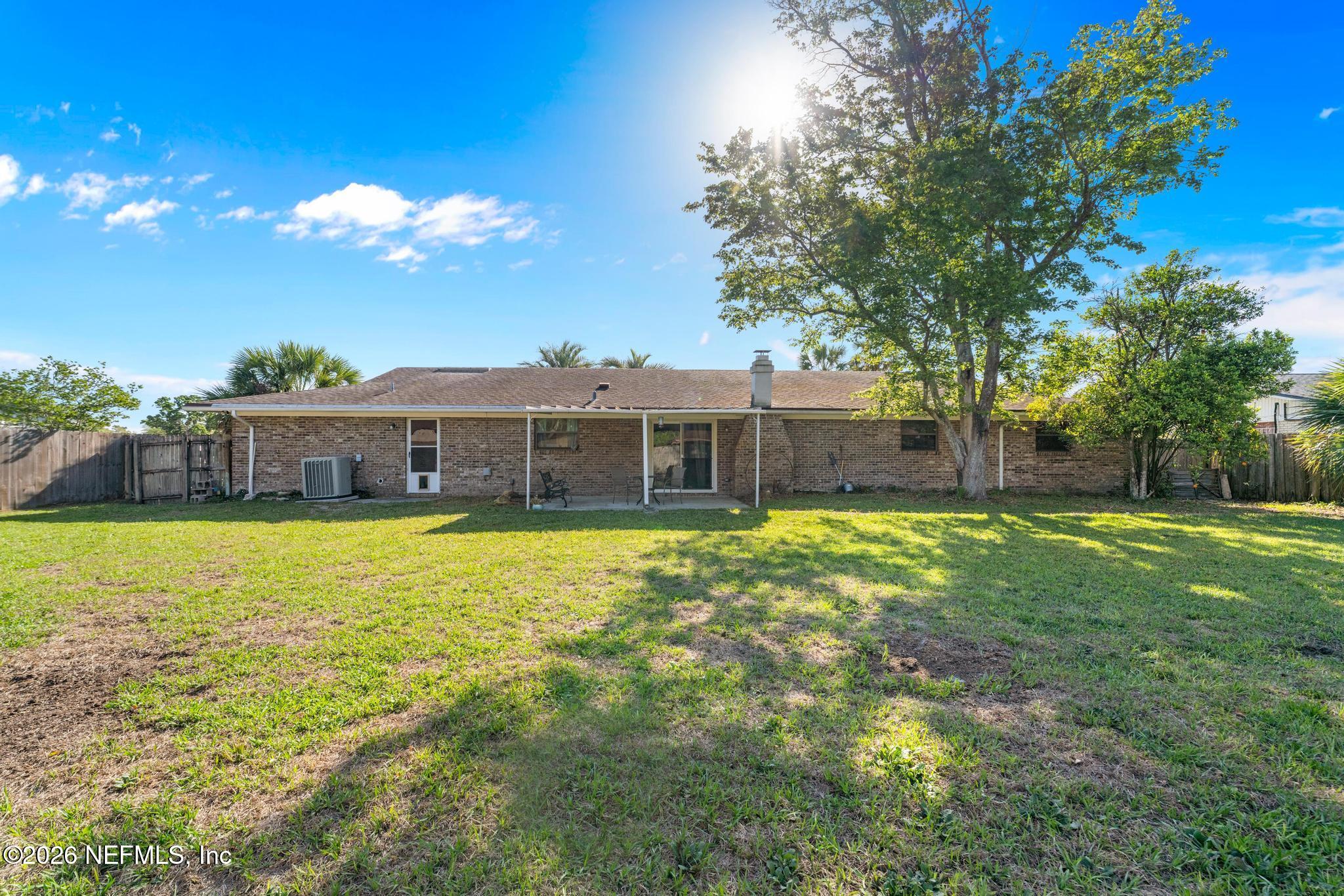5628 Fort Sumter Road Jacksonville, FL 32210 - Photo 42 of 45 a front view of house with yard space and swimming pool