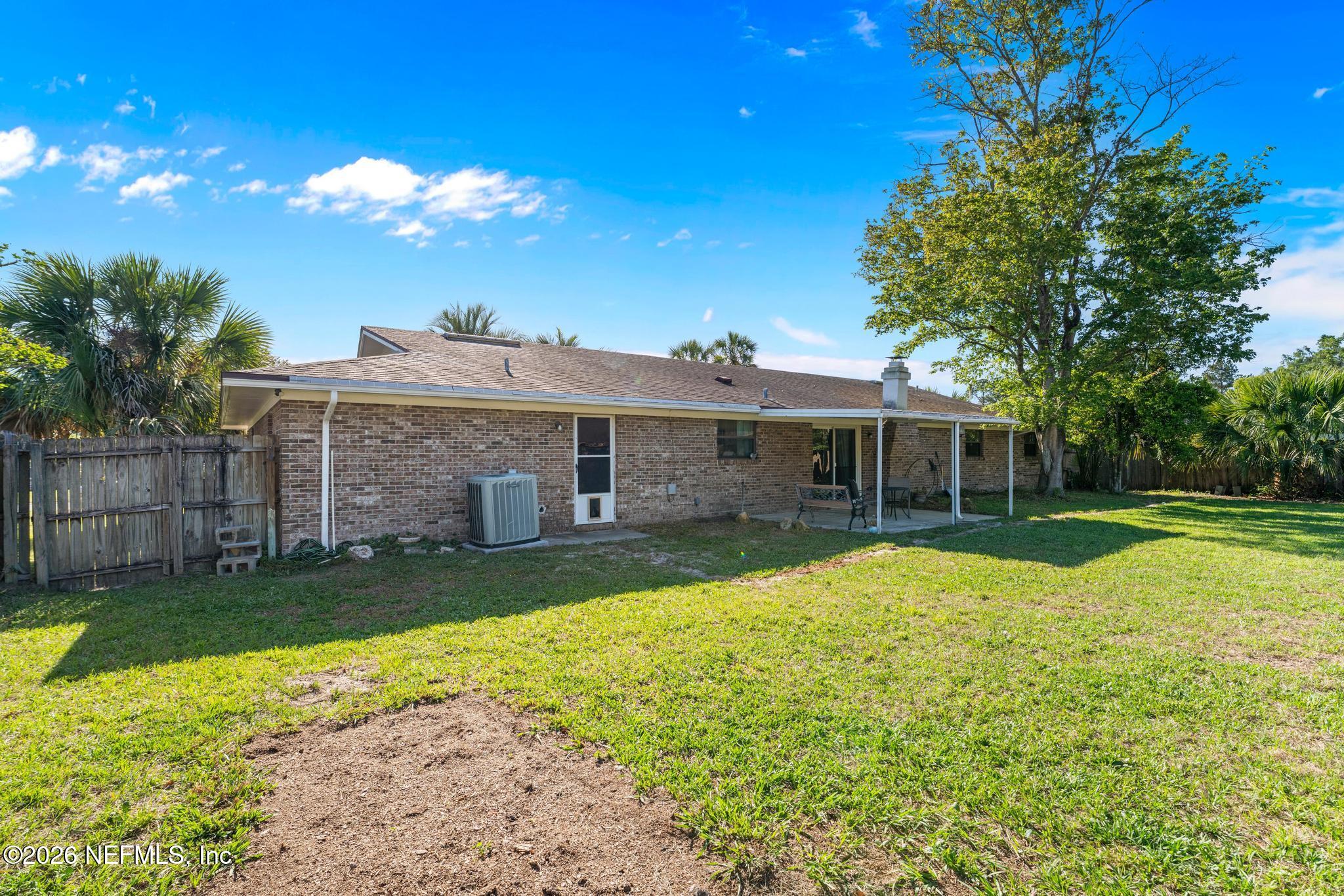 5628 Fort Sumter Road Jacksonville, FL 32210 - Photo 43 of 45 a view of a house with a yard