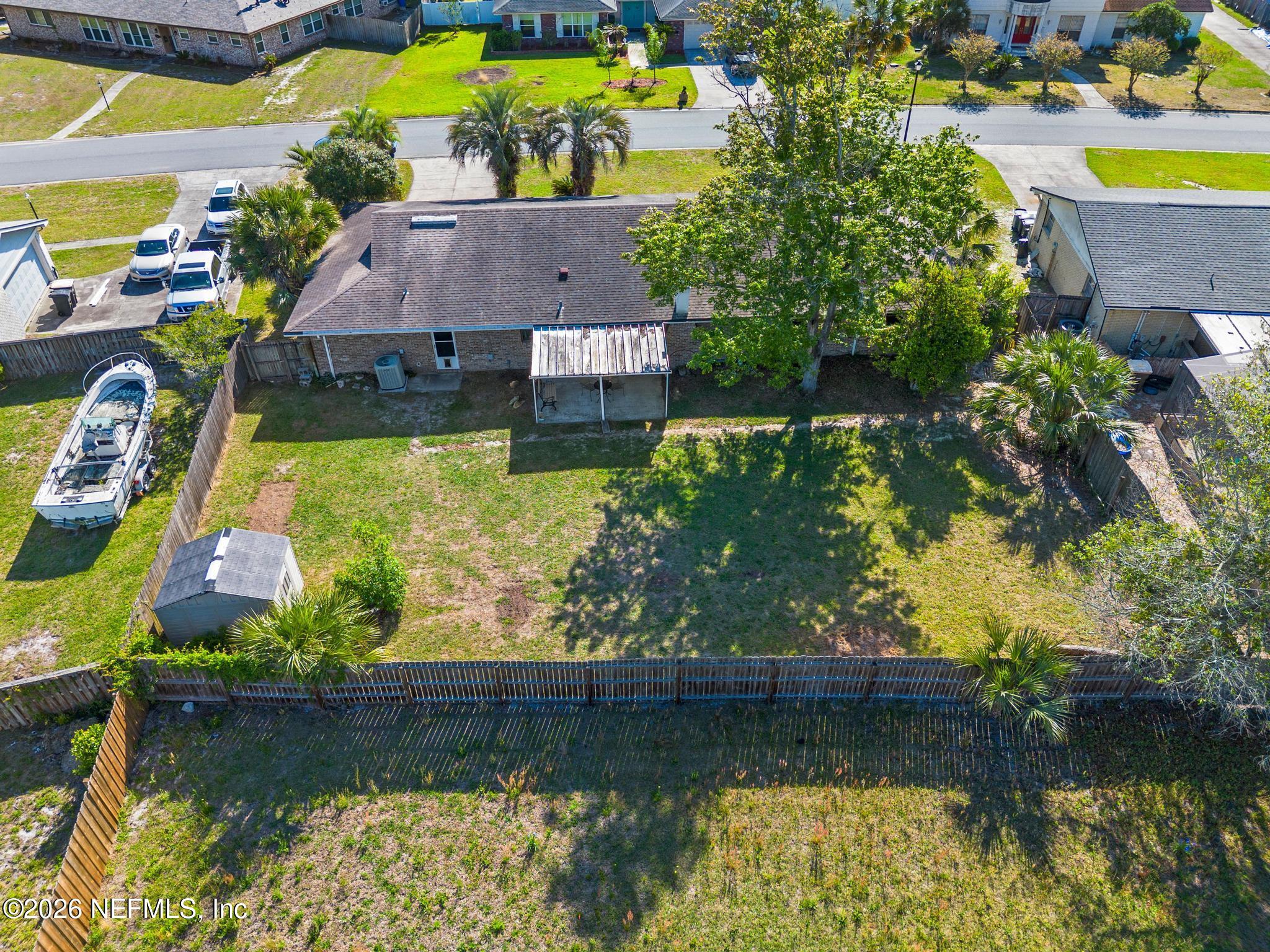 5628 Fort Sumter Road Jacksonville, FL 32210 - Photo 45 of 45 an aerial view of a house with a garden and swimming pool