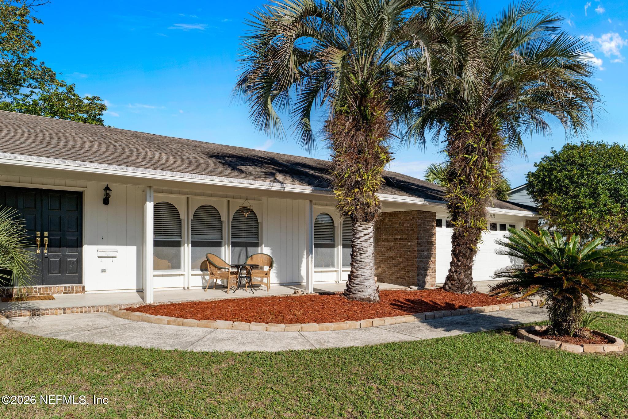 5628 Fort Sumter Road Jacksonville, FL 32210 - Photo 6 of 45 a front view of a house with garden