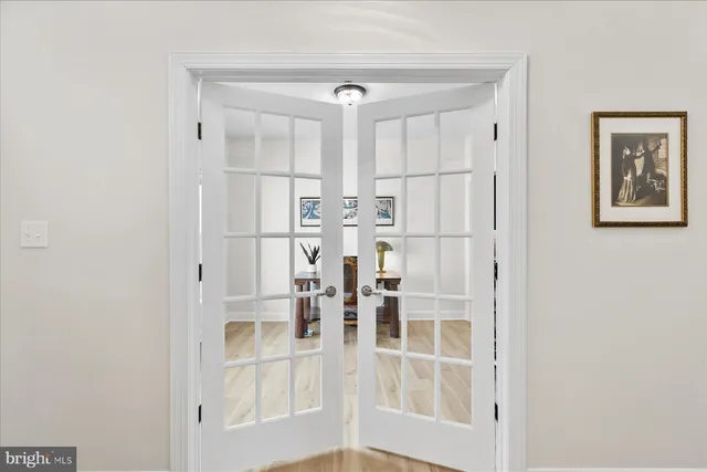 a bathroom with a glass shower door and a mirror