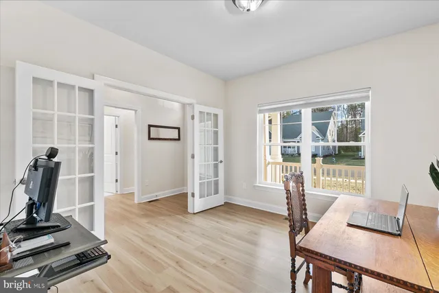 a view of a livingroom with furniture and a window