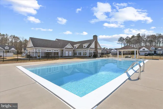 a view of a swimming pool with a lounge chairs