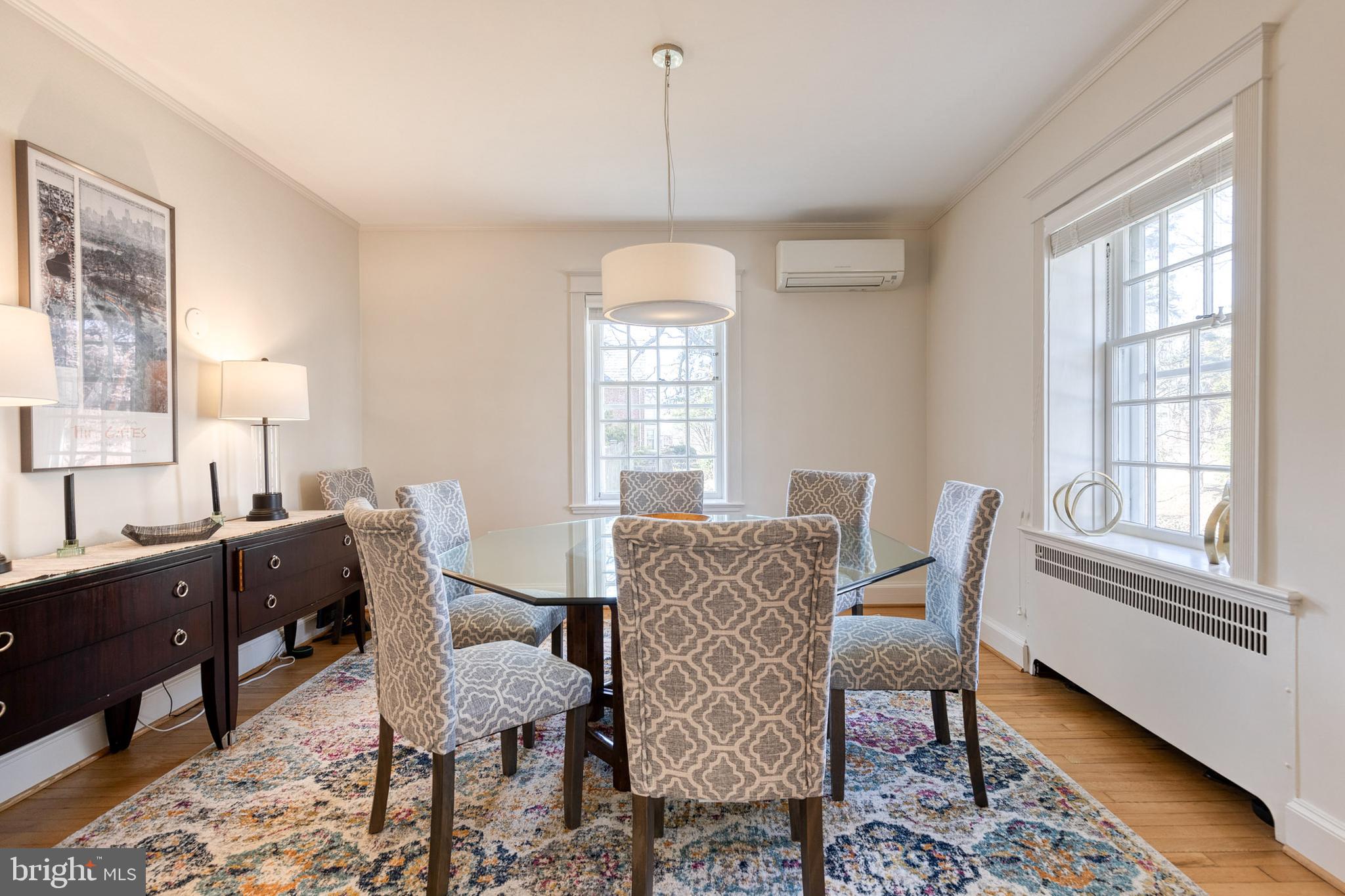 4010 Roundtop Road Baltimore, MD 21218 - Photo 19 of 51 a dining room with furniture a chandelier and wooden floor