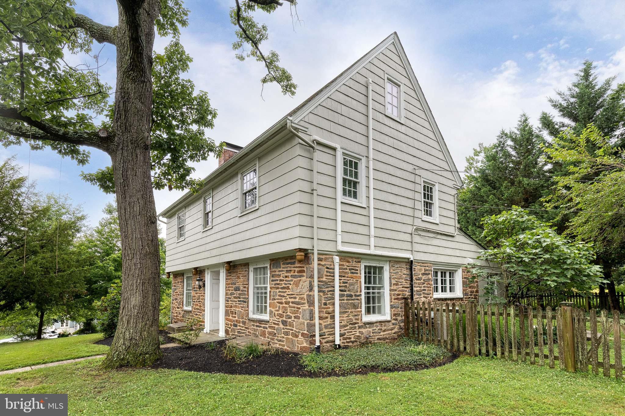 4010 Roundtop Road Baltimore, MD 21218 - Photo 5 of 51 a front view of a house with a garden