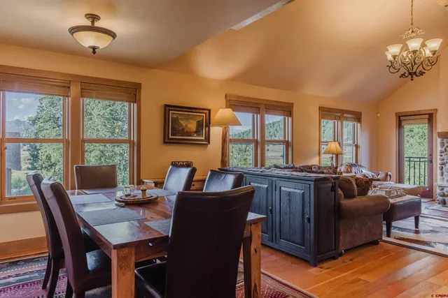 a view of a dining room with furniture window and outside view
