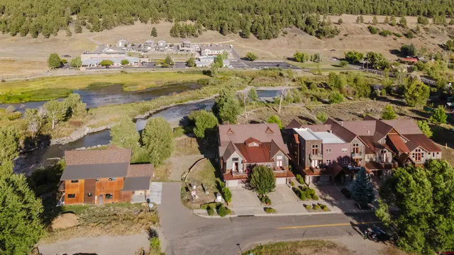 an aerial view of residential houses with outdoor space