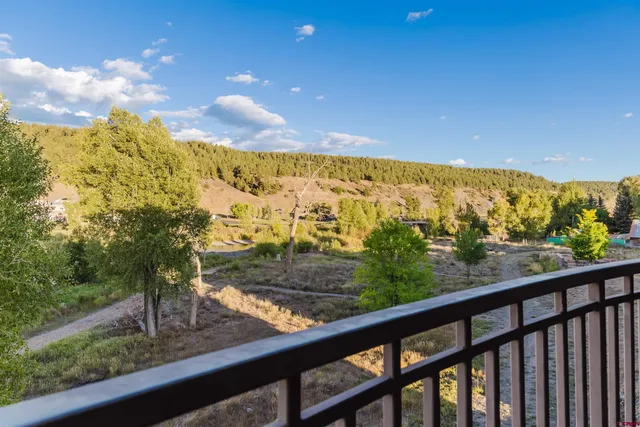 a view of a yard from a balcony
