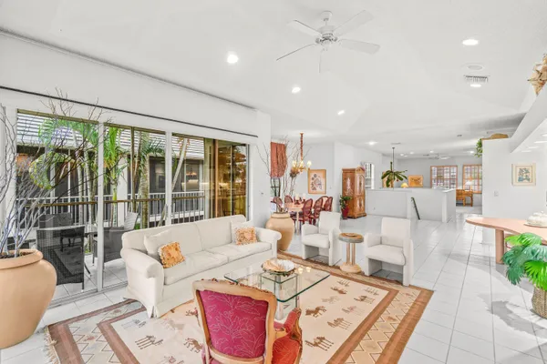 a living room with furniture and a book shelf
