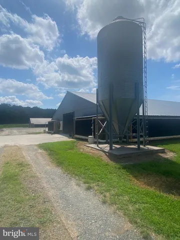 a view of a backyard with sitting area