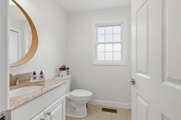 3 Wing Road Wilmington, MA 01887 - Photo 16 of 36 a bathroom with a granite countertop toilet sink and mirror
