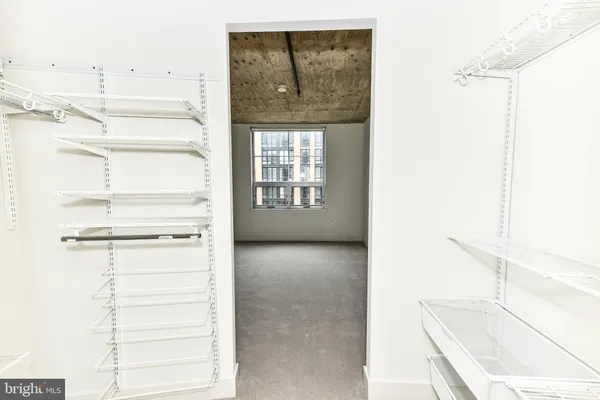 a view of an empty room with a window