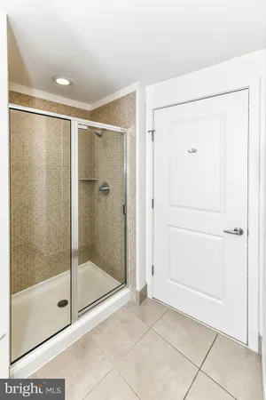 a bathroom with a sink a mirror and a shower