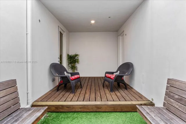 a living room with furniture and a rug