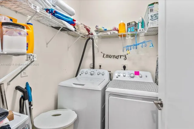 a utility room with dryer and washer