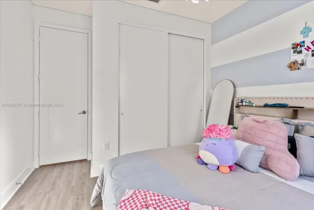 a bedroom with a bed and closet