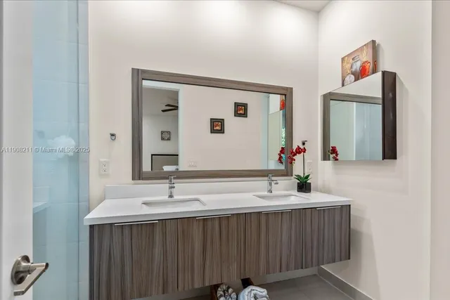 a bathroom with a sink and a mirror