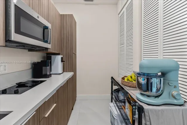 a kitchen with a stove and a microwave