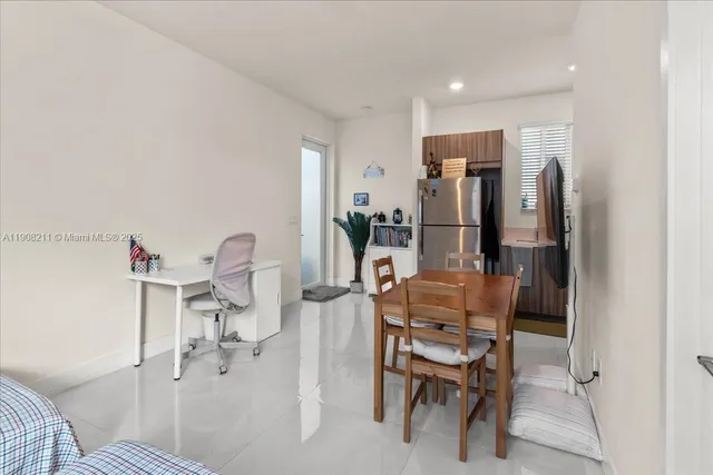 a dining room with furniture and a chandelier