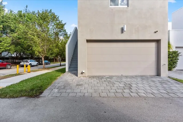 a view of garage and yard