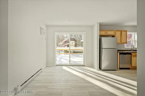 a view of a room with a large window