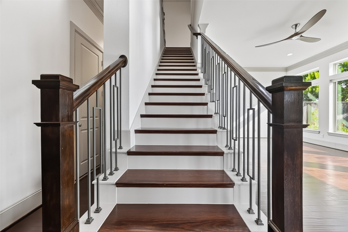 10514 Concha Lane Houston, TX 77096 - Photo 15 of 50 View of stairs from the 1st floor. Notice the real wood steps and rich dark stain of the wood bannister & posts. You will love the elegant, decorative wrought iron spindles.
