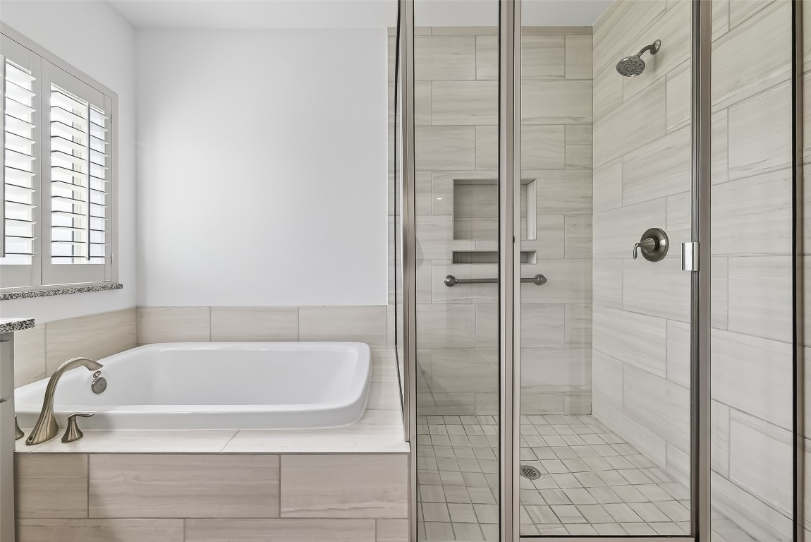 10514 Concha Lane Houston, TX 77096 - Photo 19 of 50 Glass Shower with built-in niche shelf for bath products.