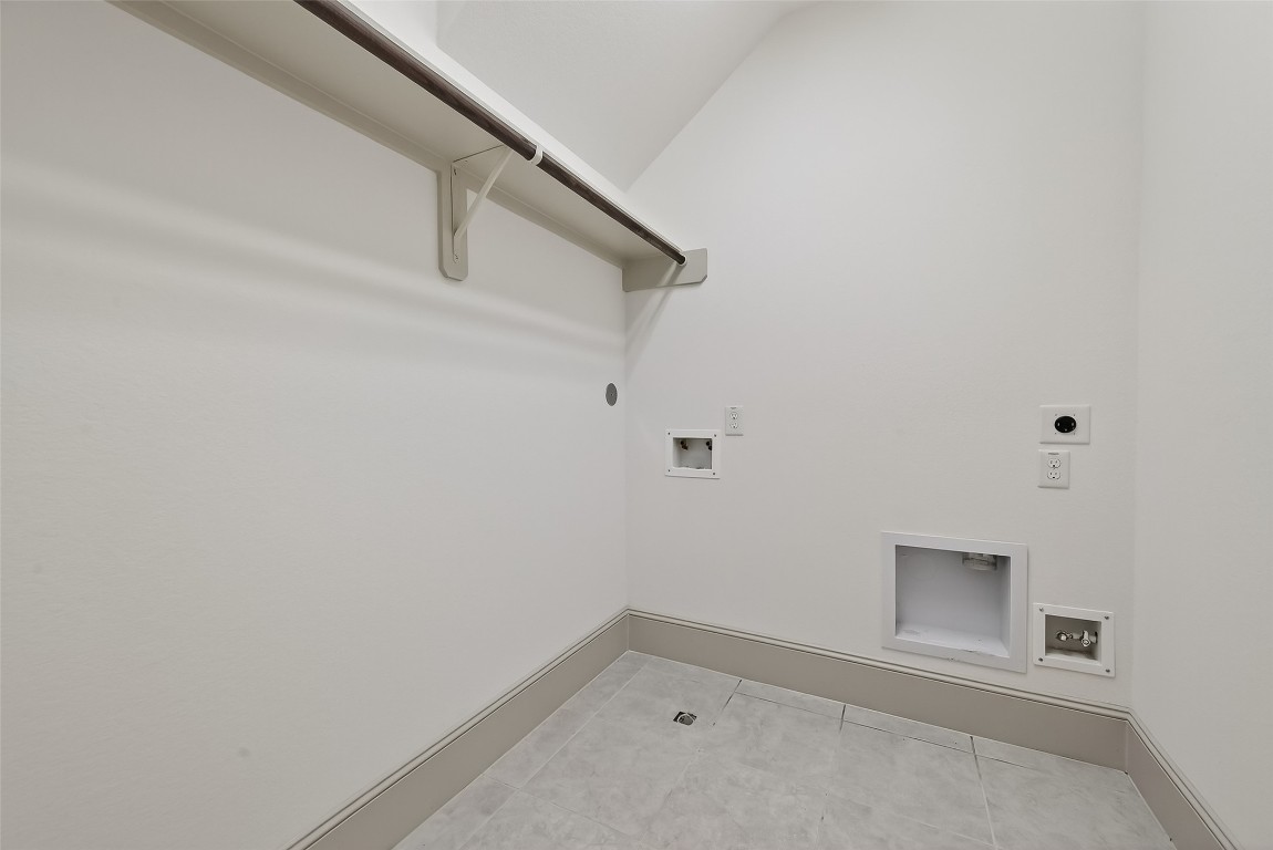 10514 Concha Lane Houston, TX 77096 - Photo 24 of 50 Laundry room with handy clothes rod conveniently located on 2nd floor.