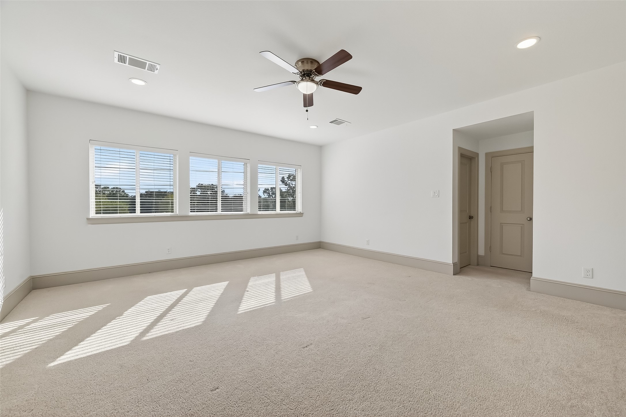 10514 Concha Lane Houston, TX 77096 - Photo 27 of 50 Huge 3rd floor game room with recessed lights, ceiling fan, lots of windows for natural light. Great view of greenspace with no neighbors directly behind.